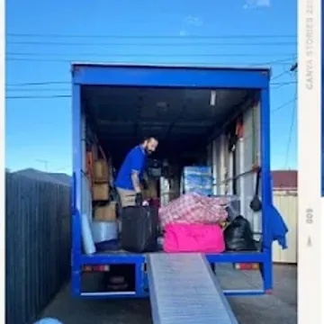 A crew member loading a blue House Removalists Melbourne truck up the ramp